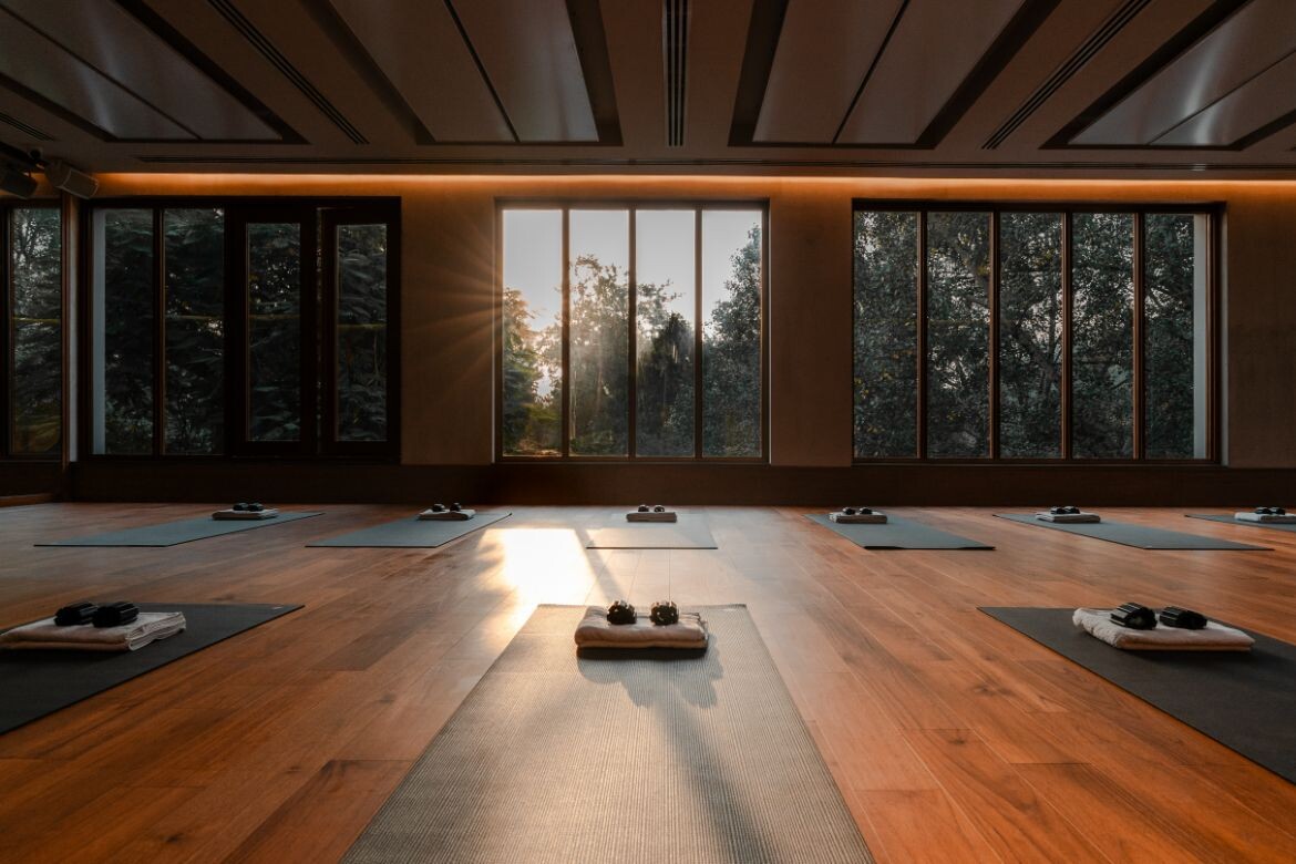 Modern hot yoga studio with heated floors and serene atmosphere